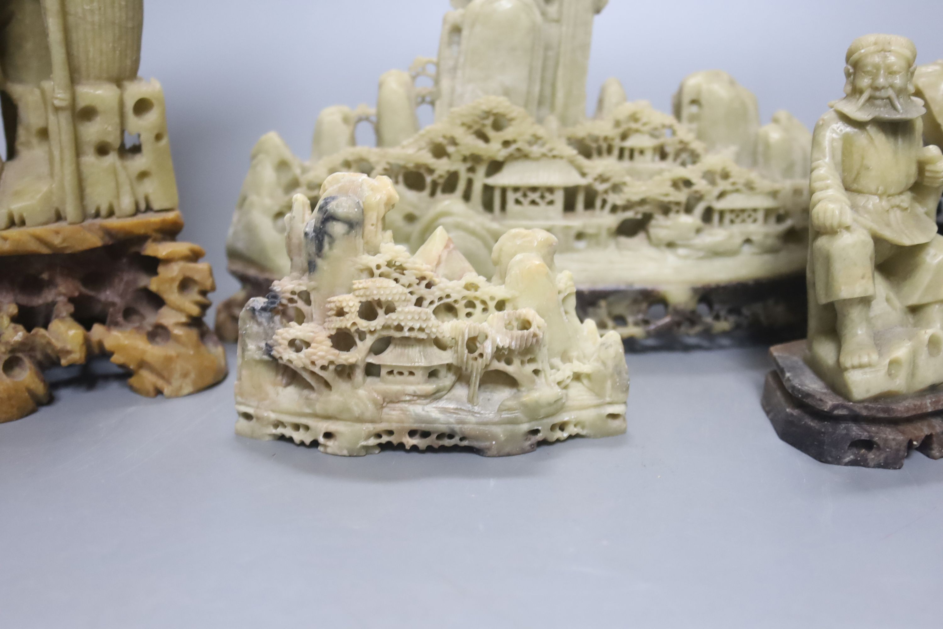 Seven Chinese soapstone carvings, 4 figurative carvings, largest 26 cms high including base.
